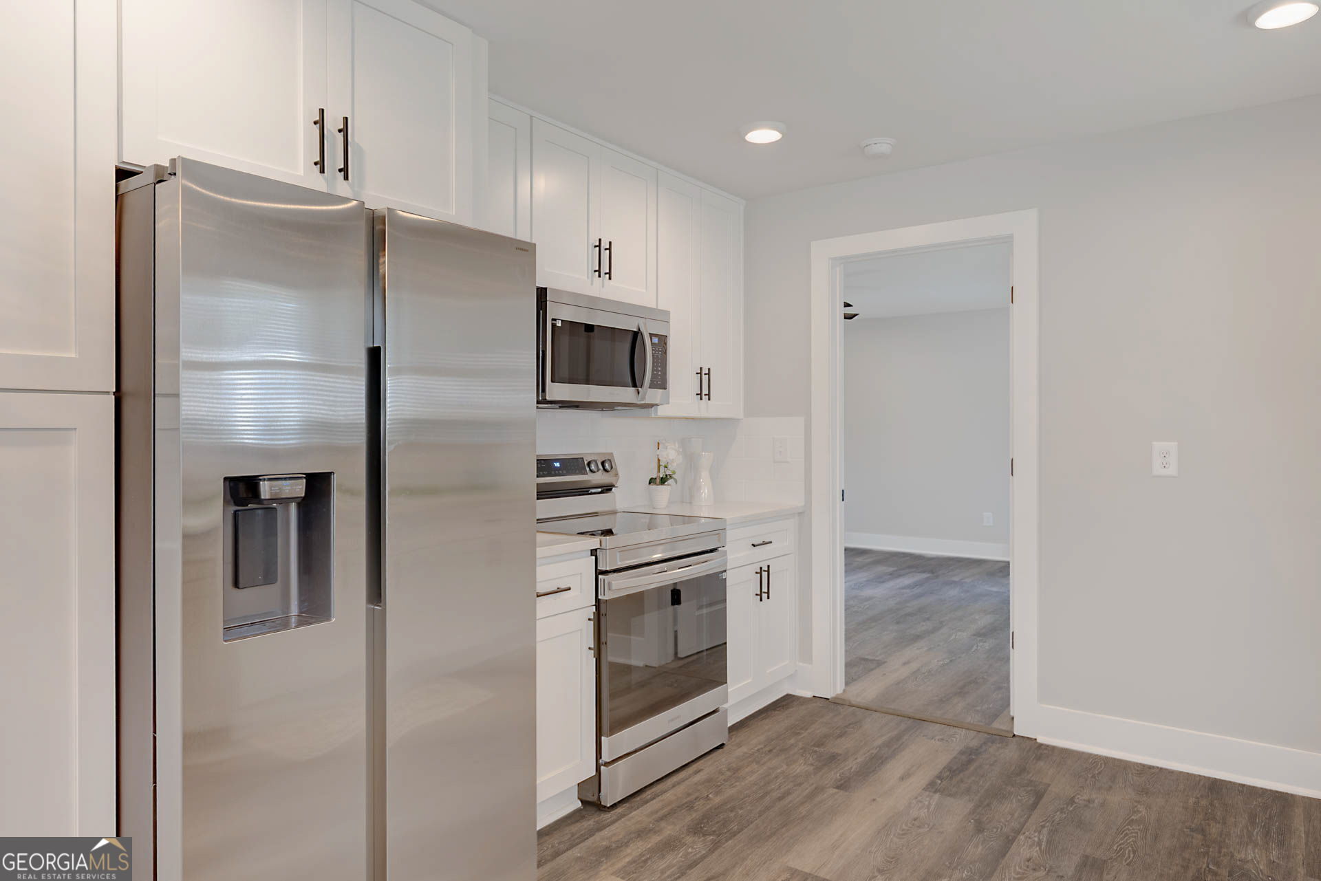 326 Mobley Street Hamilton, GA 31811 - Photo 11 of 27 a kitchen with stainless steel appliances a refrigerator sink and microwave