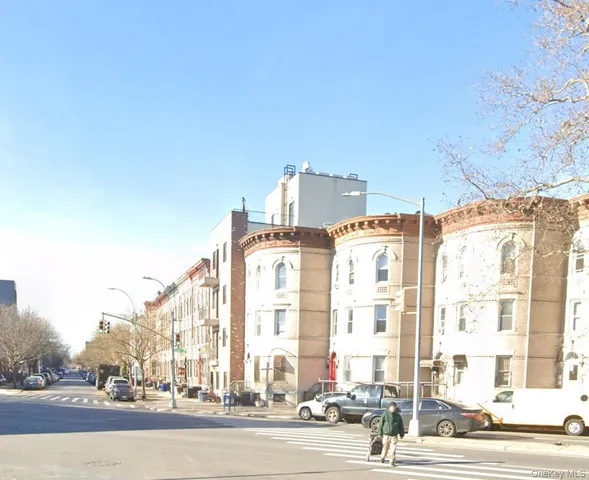 a view of a building with a street