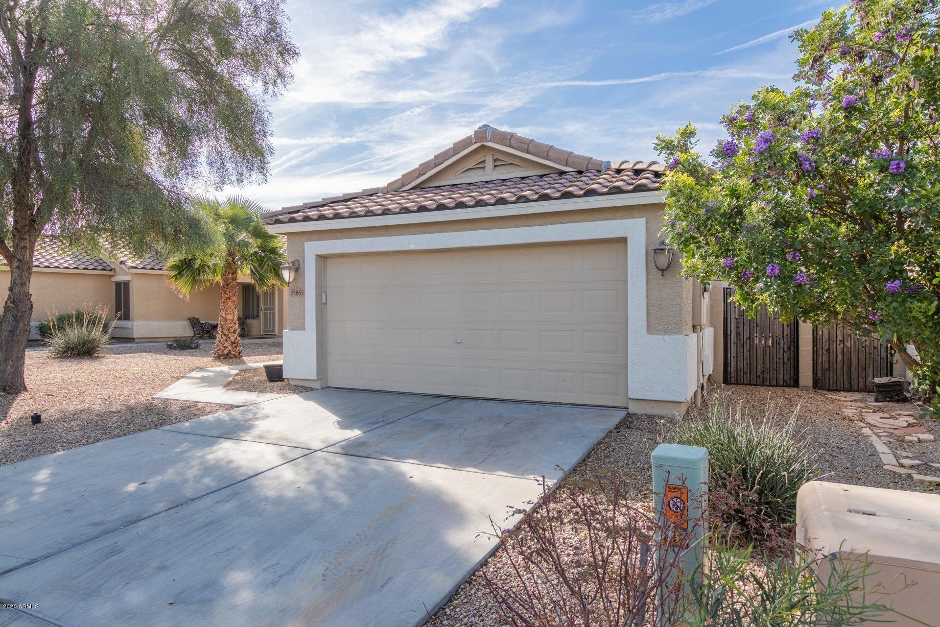 25865 West Dunlap Road Buckeye, AZ 85326 - Photo 3 of 29 a view of a house with a yard and garage
