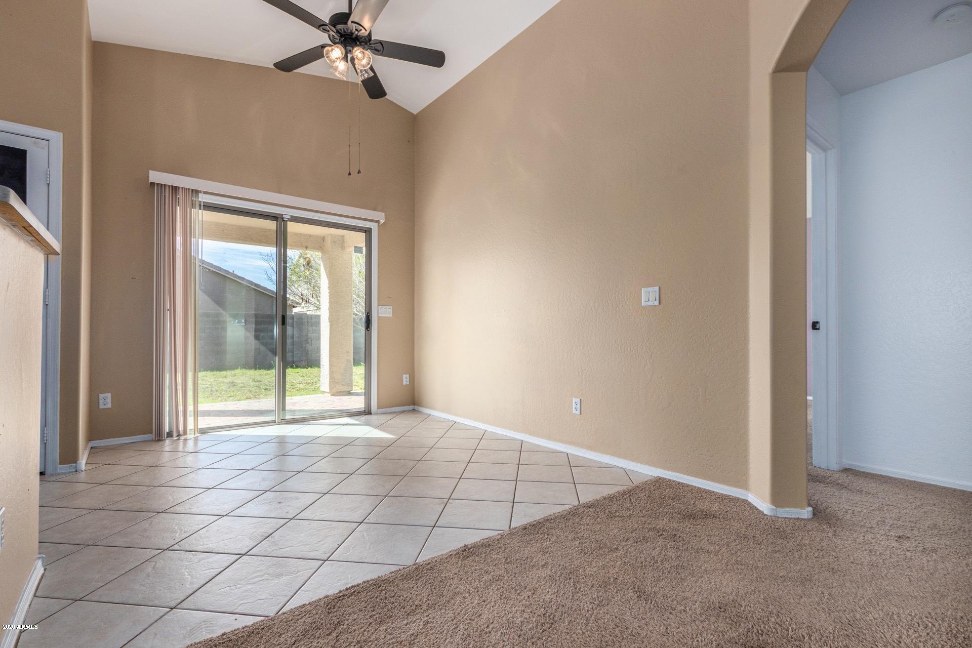 25865 West Dunlap Road Buckeye, AZ 85326 - Photo 8 of 29 a view of an empty room with a window