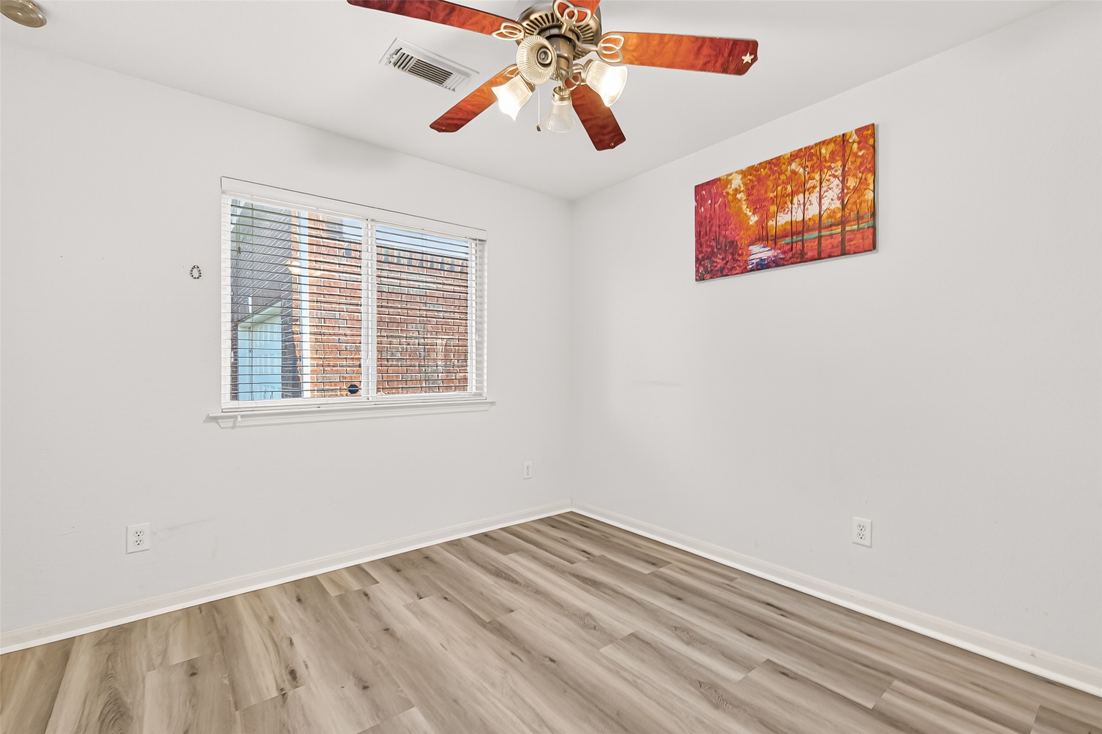 16715 Mackenzie Mesa Drive Spring, TX 77379 - Photo 28 of 50 a view of empty room with wooden floor and fan