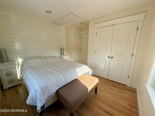 a bedroom with a bed and a table