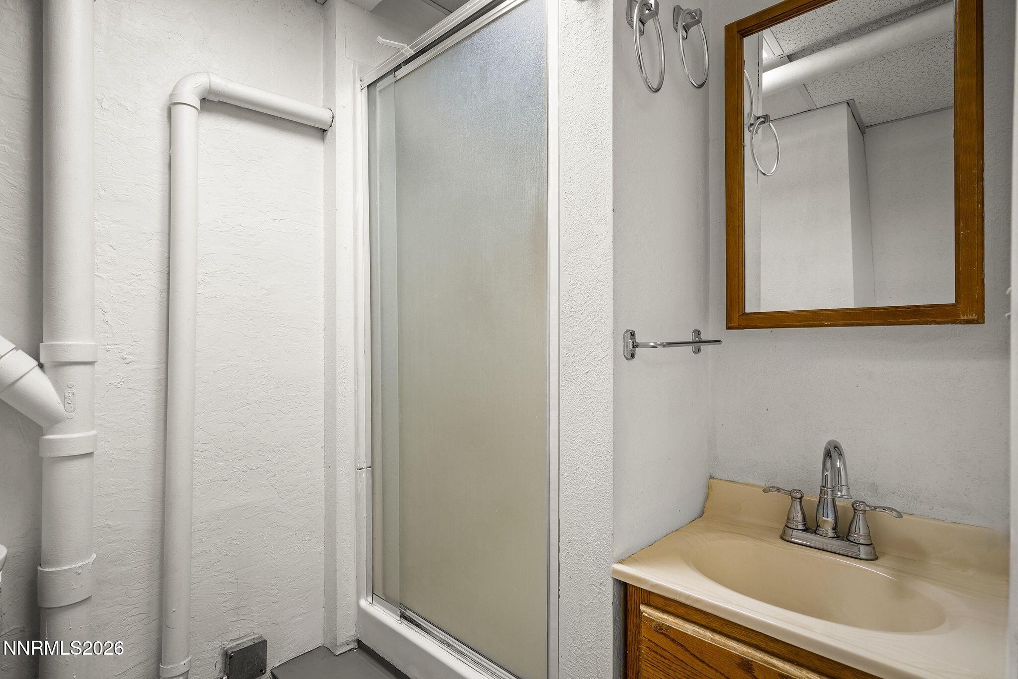 2985 Socrates Drive Reno, NV 89512 - Photo 34 of 52 a bathroom with a sink and a mirror
