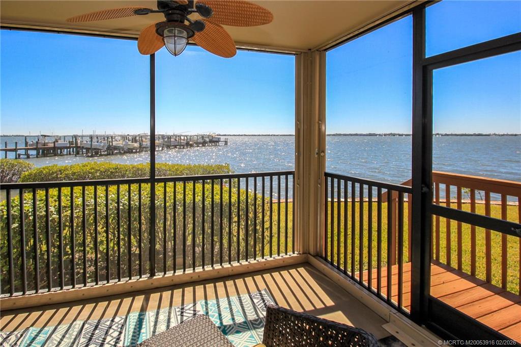 4490 Northeast Sandpebble Trace, Unit 105 Stuart, FL 34996 - Photo 6 of 38 a view of a balcony with a floor to ceiling window next to a road