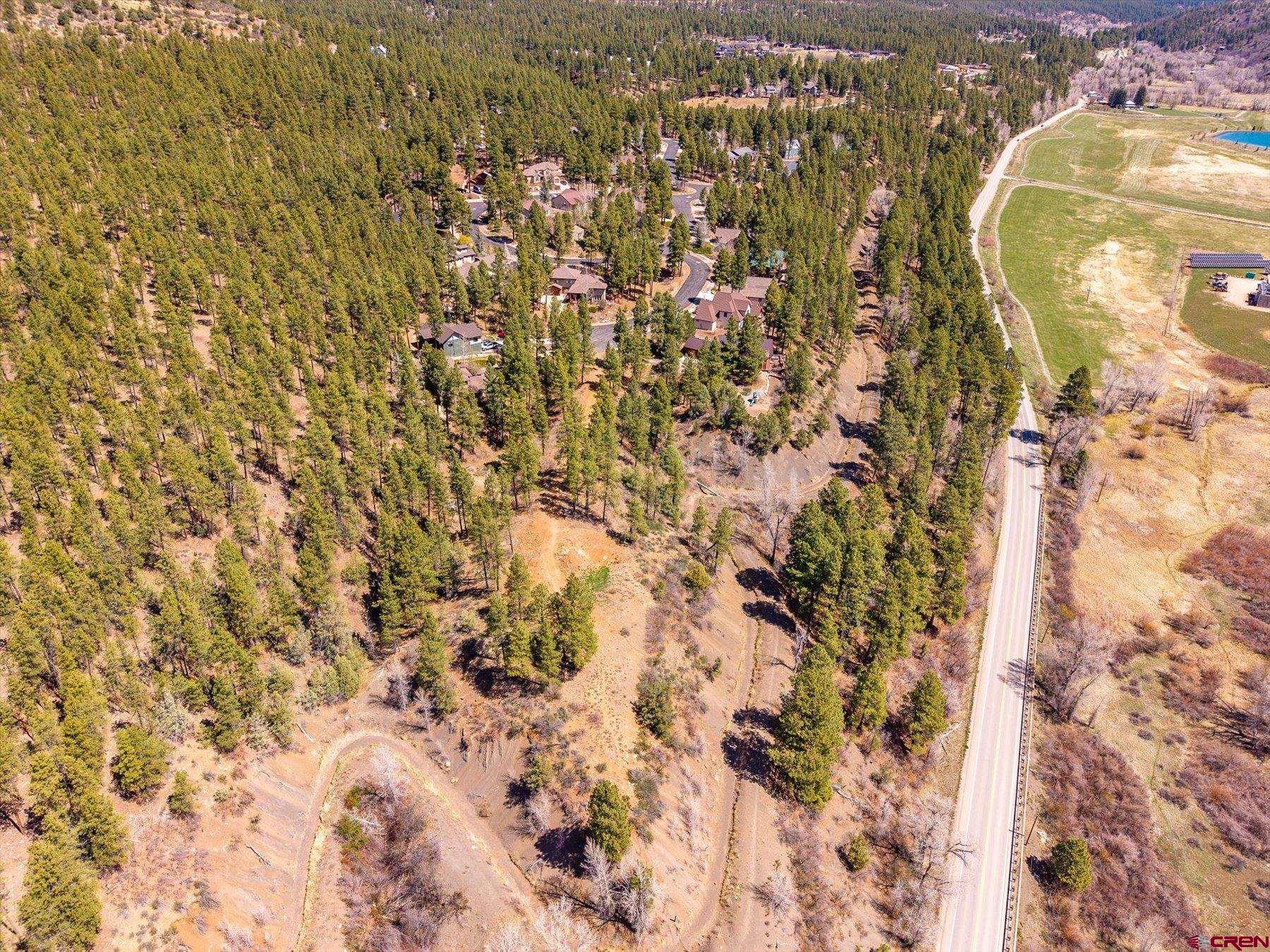 77 Culebra Circle Durango, CO 81301 - Photo 23 of 29 a aerial view of a house with a swimming pool and large trees