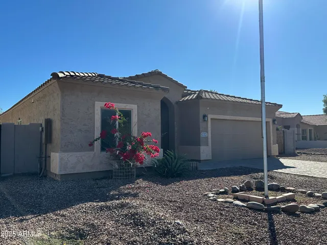 a view of a house with a small yard