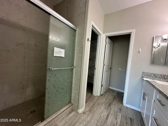 a view of a bathroom from a hallway