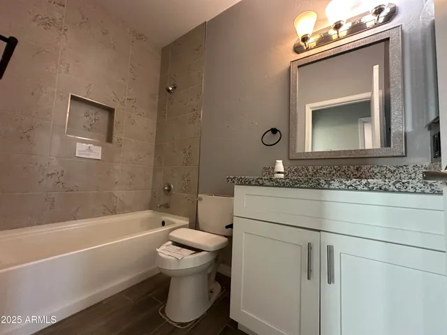 a bathroom with a toilet sink and bathtub