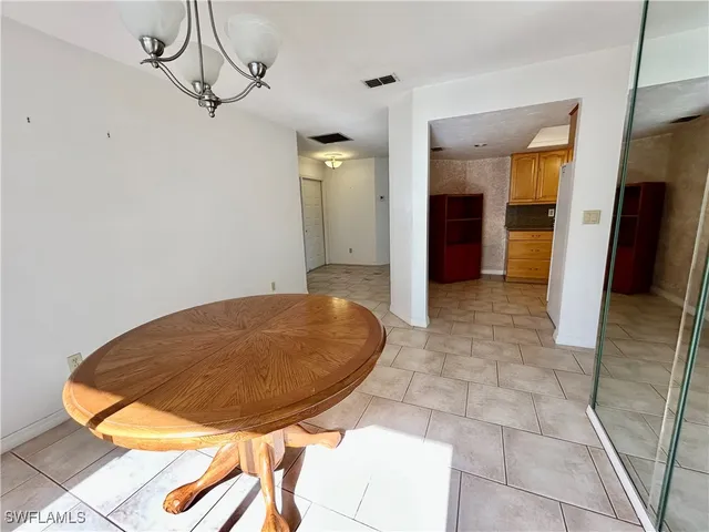 a view of a hallway with a chandelier