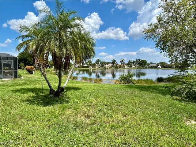 a view of a lake with a yard