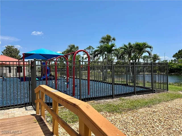 a living room with lots of furniture and a chandelier