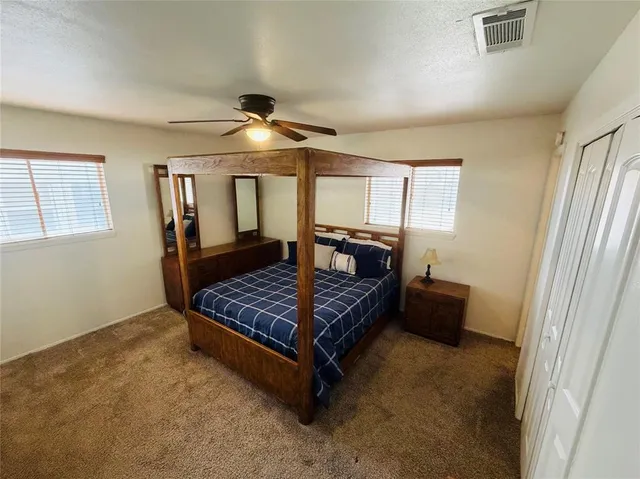 a bedroom with furniture and window