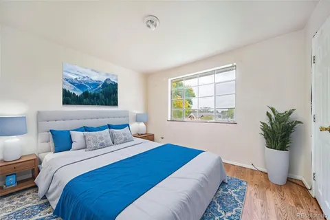 a bedroom with bed and a window