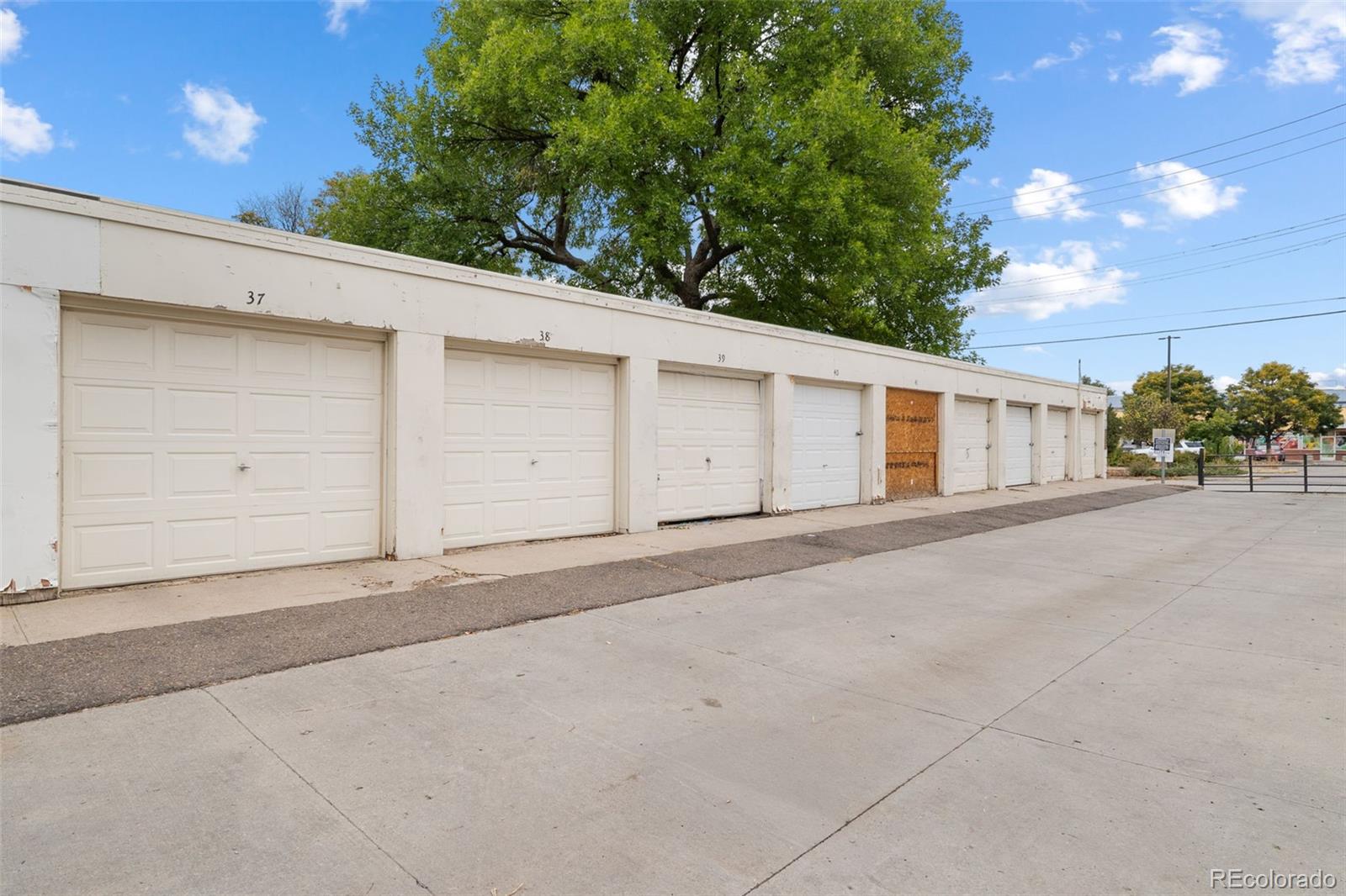 1456 Galena Street Aurora, CO 80010 - Photo 27 of 34 a view of a house with a garage
