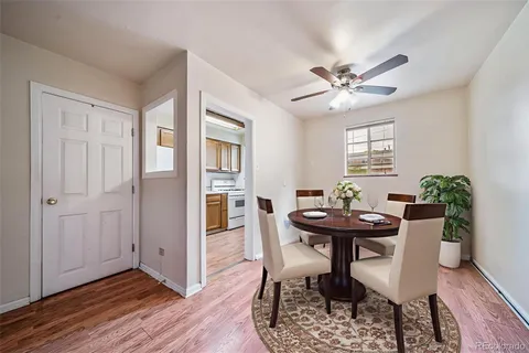 a view of a dining room with furniture and window