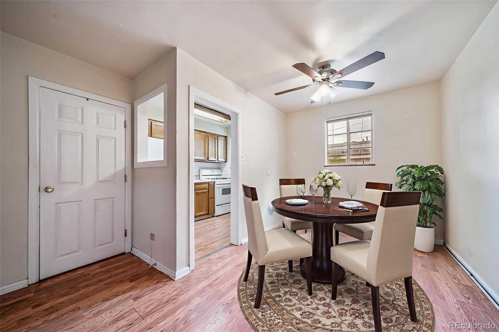 1456 Galena Street Aurora, CO 80010 - Photo 10 of 34 a view of a dining room with furniture and window