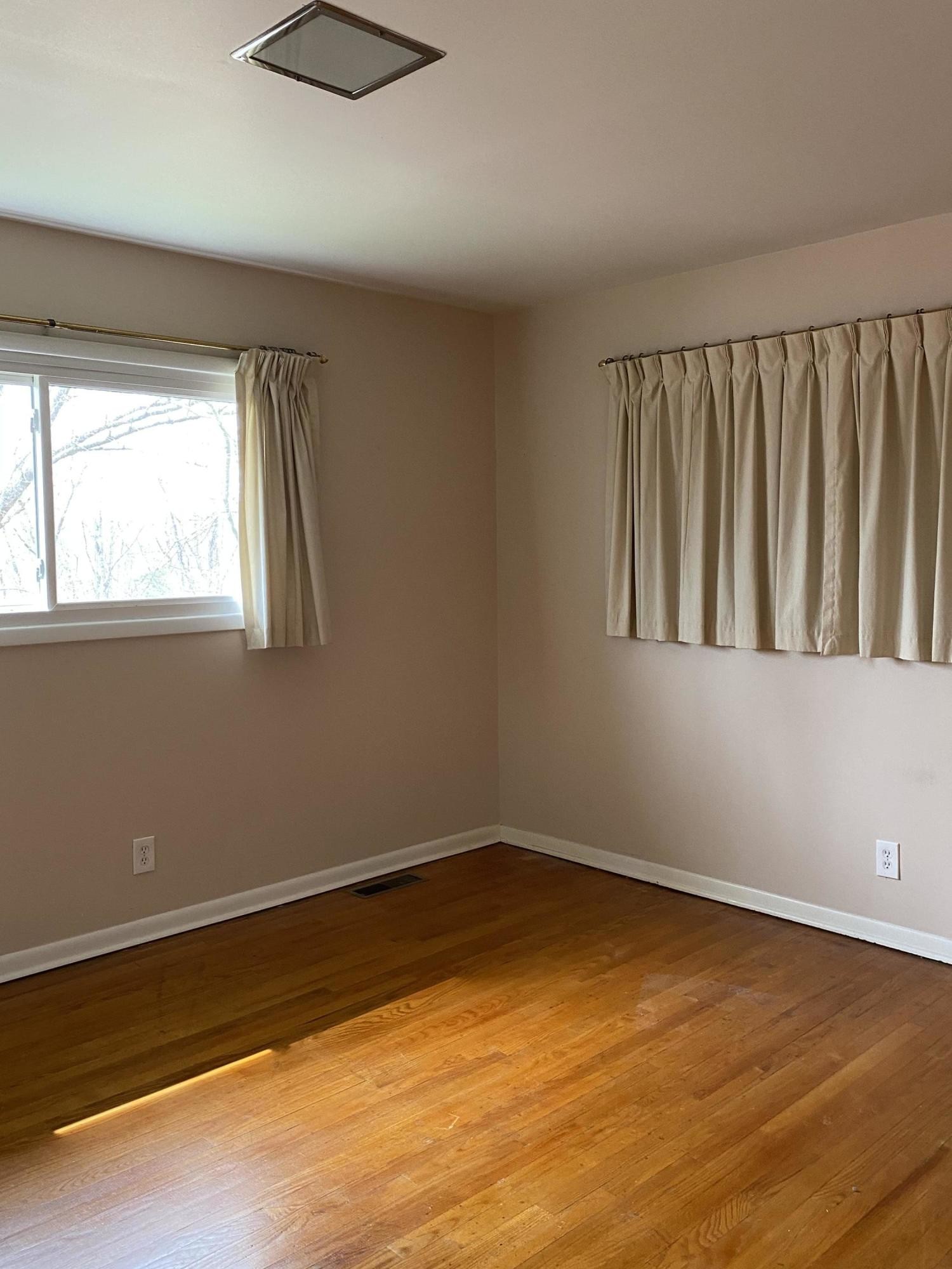 107 Morgan Road Oak Ridge, TN 37830 - Photo 15 of 24 a view of an empty room with wooden floor and a window