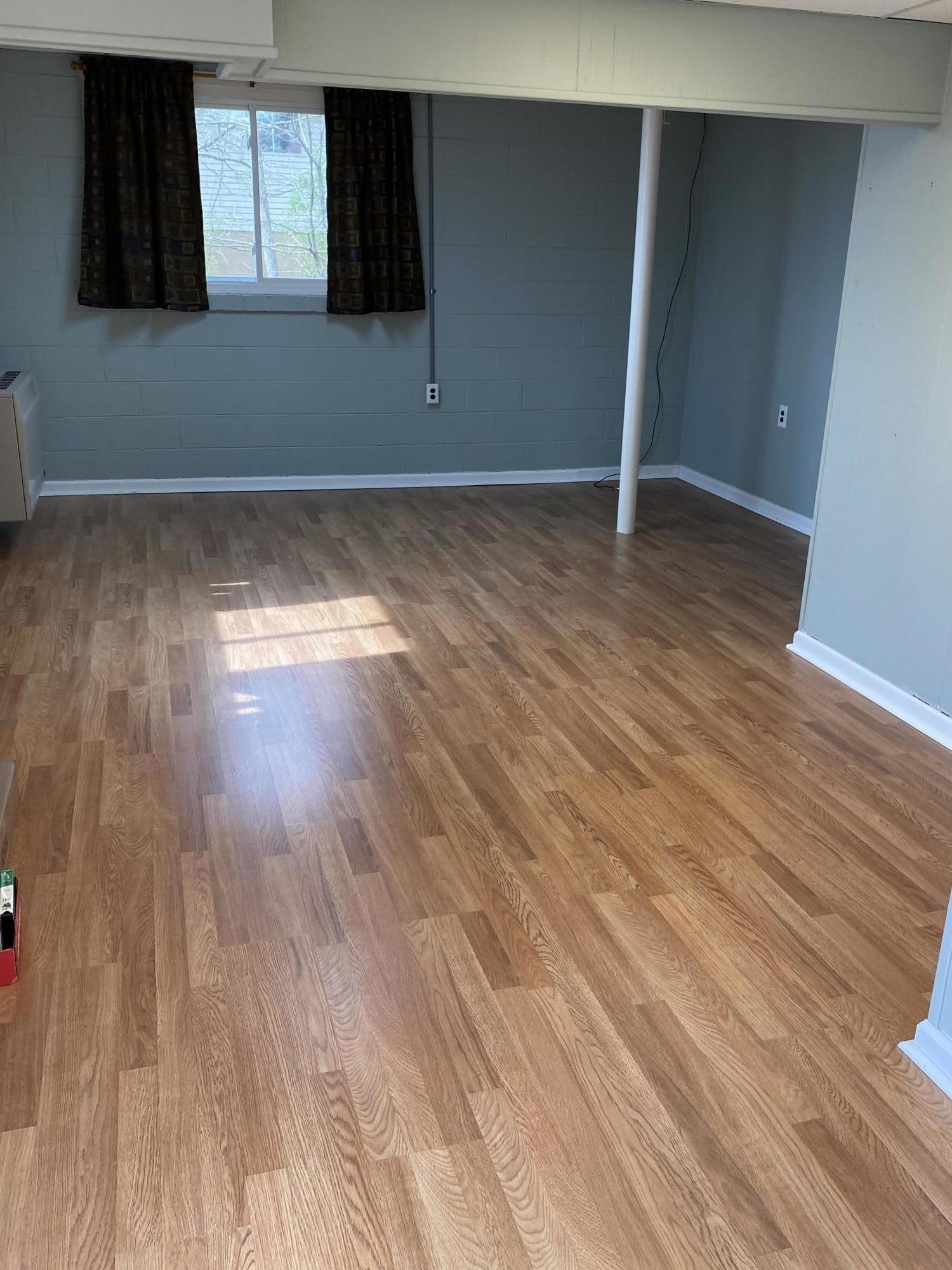 107 Morgan Road Oak Ridge, TN 37830 - Photo 21 of 24 a view of an empty room with wooden floor and a window