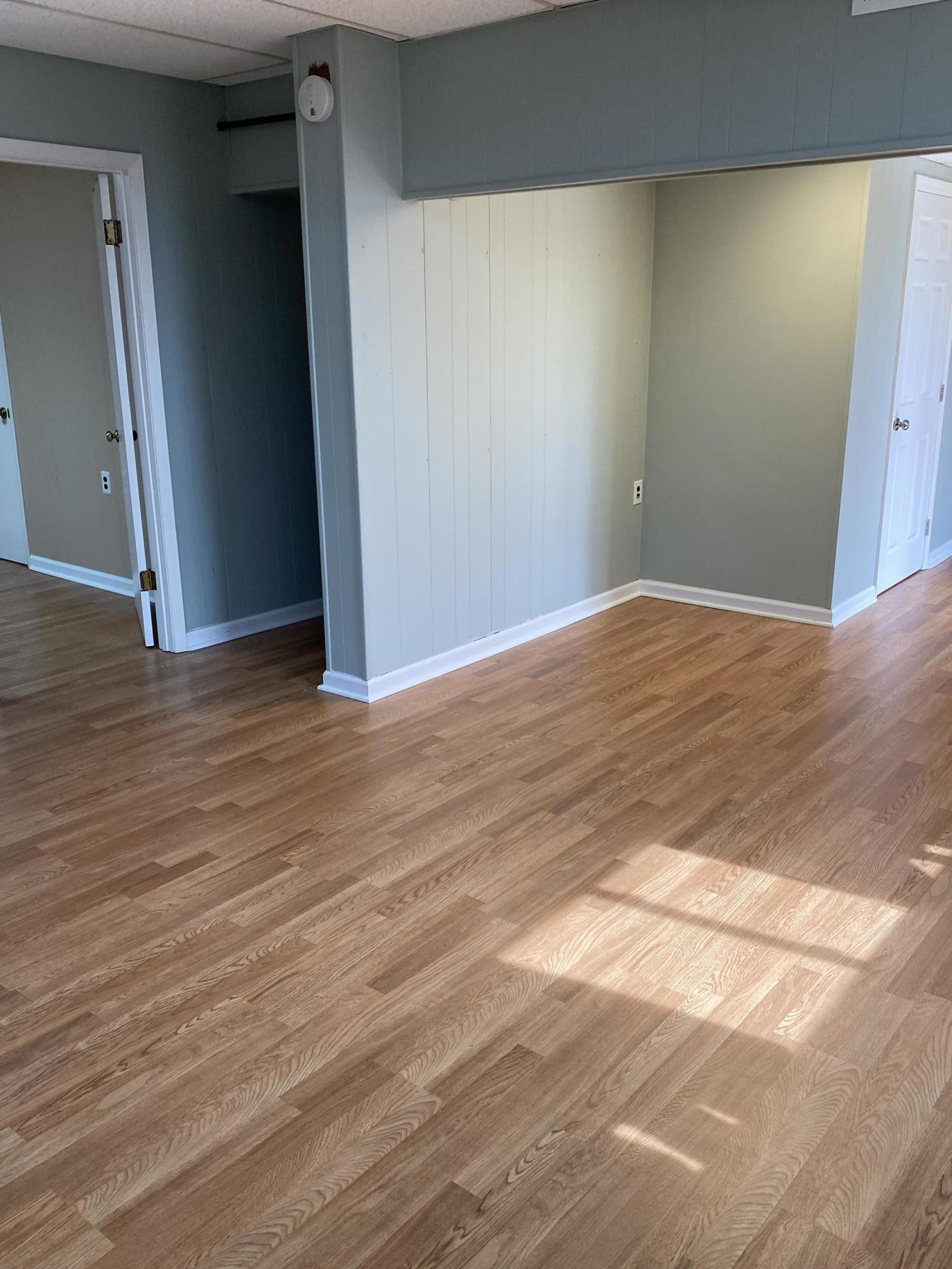 107 Morgan Road Oak Ridge, TN 37830 - Photo 22 of 24 a view of an empty room with wooden floor and a window