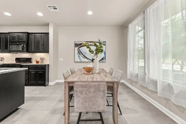 a view of a dining room with furniture window and outside view
