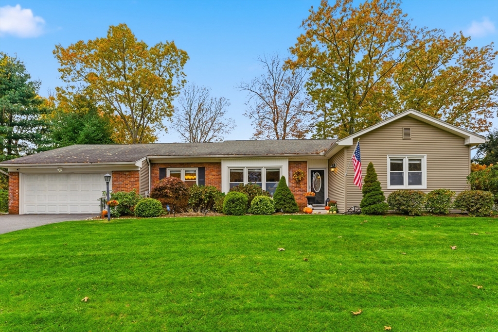 a front view of a house and a yard