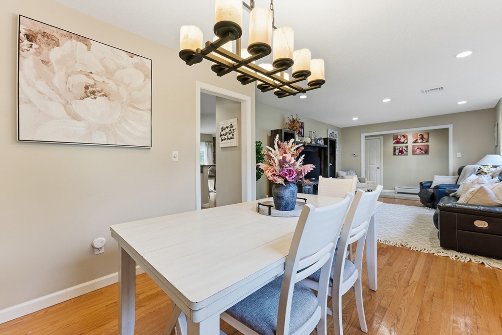 120 Inverness Lane Longmeadow, MA 01106 - Photo 11 of 42 a view of a dining room with furniture and chandelier