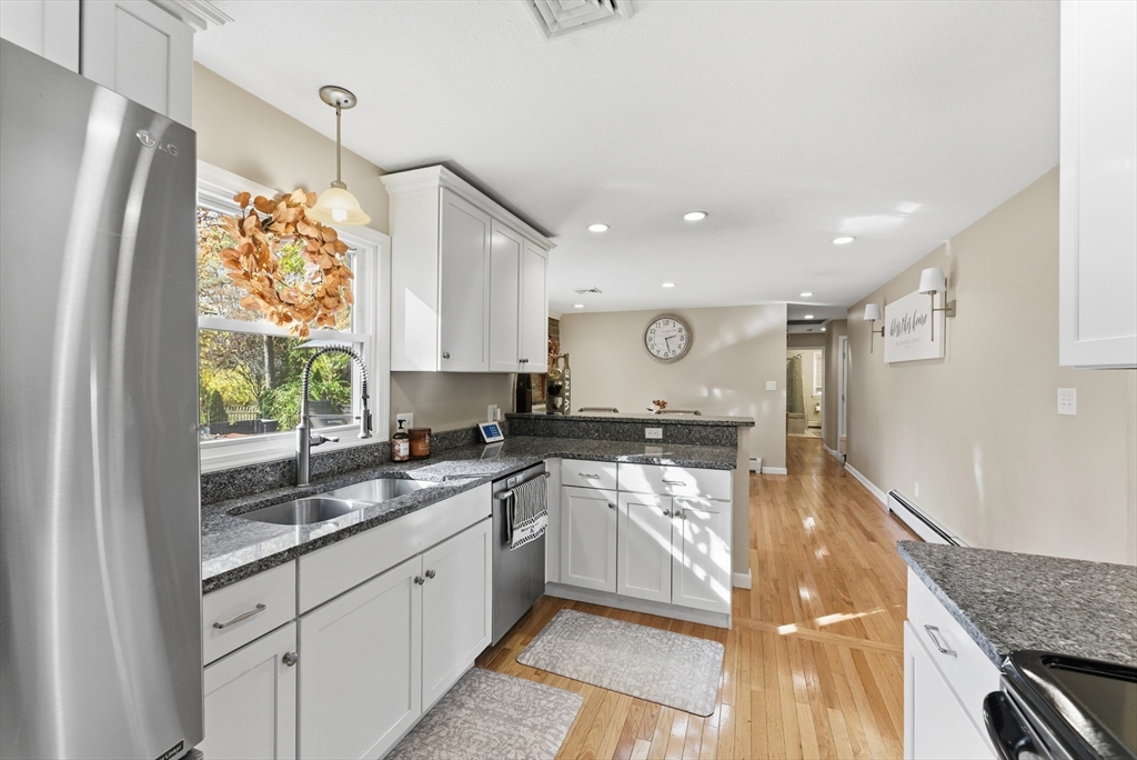 120 Inverness Lane Longmeadow, MA 01106 - Photo 18 of 42 a kitchen with a sink stainless steel appliances cabinets and a window