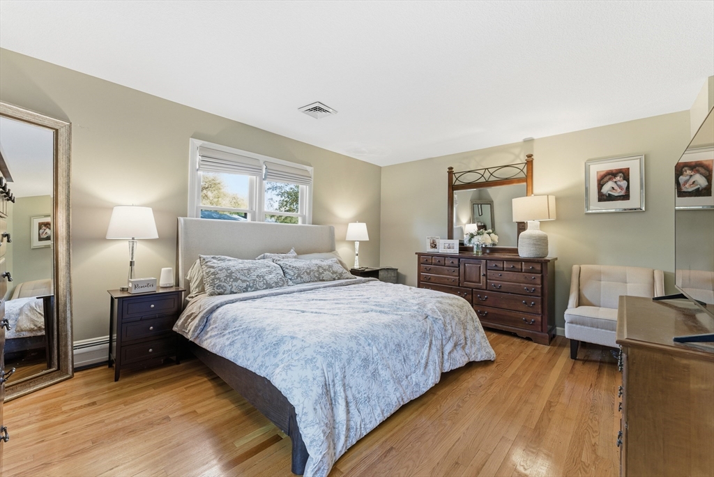 120 Inverness Lane Longmeadow, MA 01106 - Photo 30 of 42 a bedroom with a bed and wooden floor