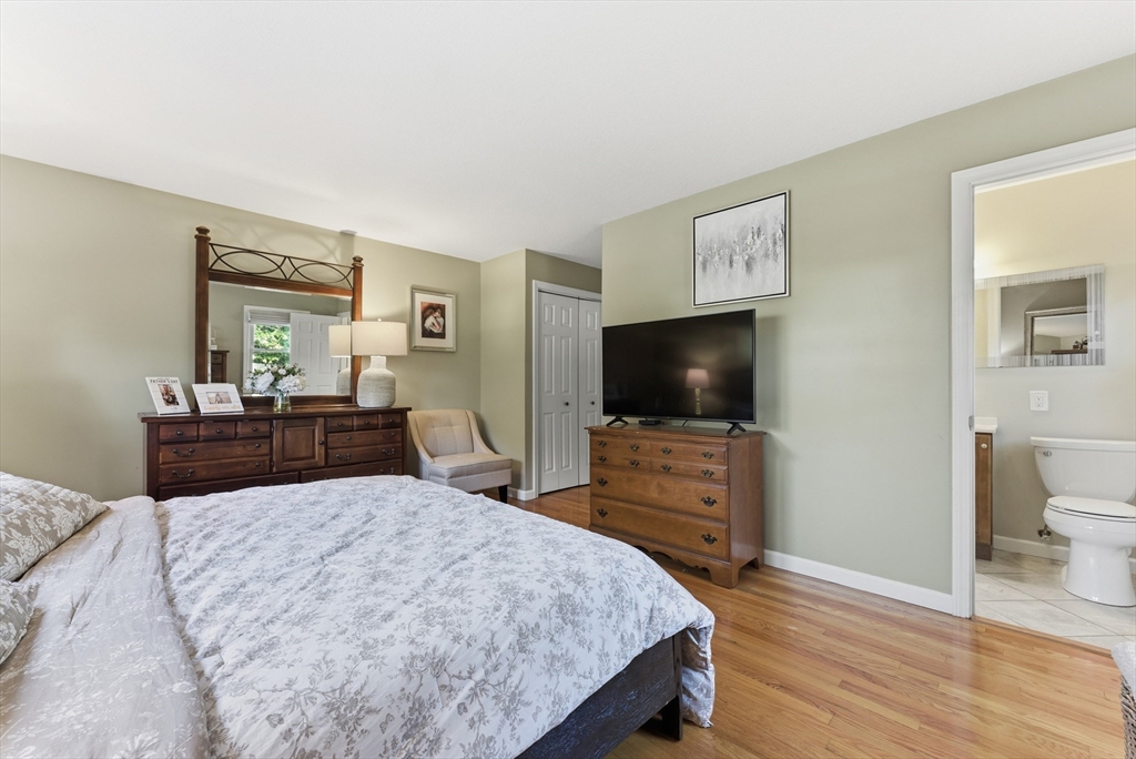 120 Inverness Lane Longmeadow, MA 01106 - Photo 31 of 42 a bedroom with a bed and a flat screen tv