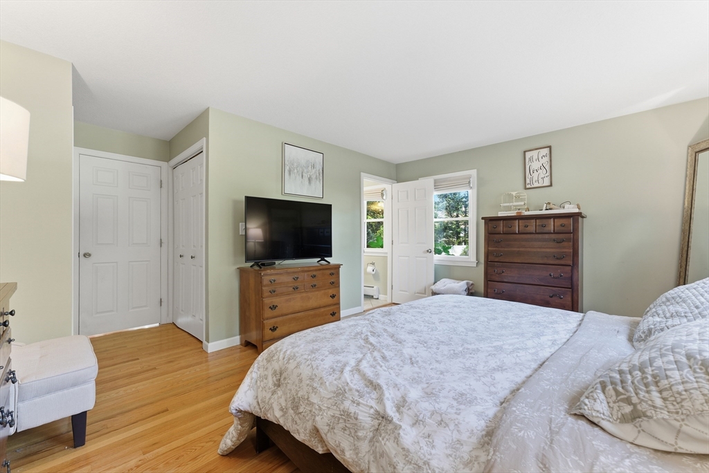 120 Inverness Lane Longmeadow, MA 01106 - Photo 32 of 42 a bedroom with a bed and wooden floor