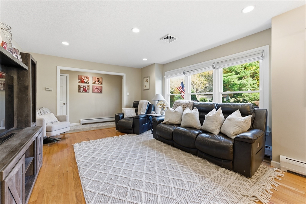 120 Inverness Lane Longmeadow, MA 01106 - Photo 6 of 42 a living room with furniture and a flat screen tv