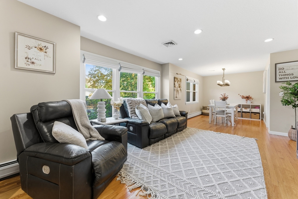 120 Inverness Lane Longmeadow, MA 01106 - Photo 9 of 42 a living room with furniture and a large window