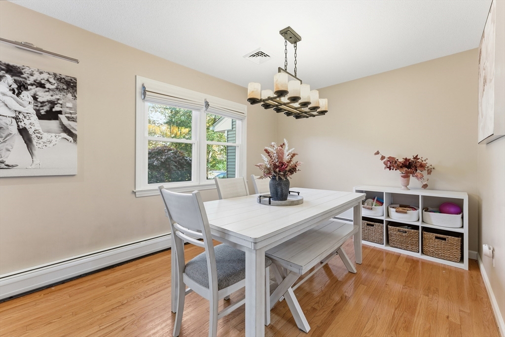 120 Inverness Lane Longmeadow, MA 01106 - Photo 10 of 42 a view of a dining room with furniture wooden floor and a chandelier