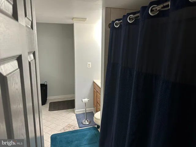 a kitchen with a refrigerator and a sink