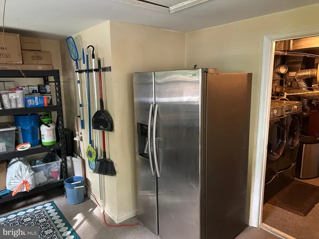 a white toilet sitting next to a bath tub