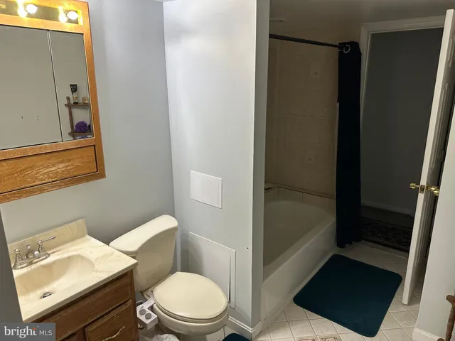 a bedroom with bed and a window