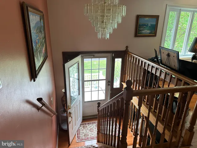 a table with a desk and chair with wooden floor