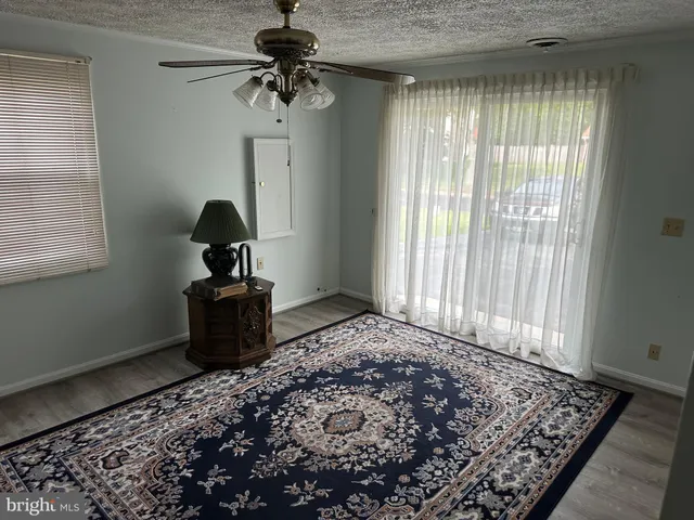 a view of an outdoor sitting area with furniture and wooden floor