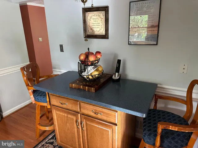 a kitchen with sink refrigerator and window