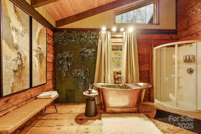 a view of a balcony with furniture and shower