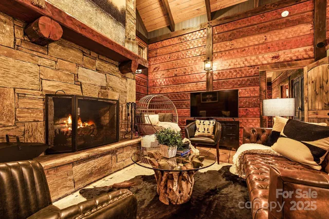 a living room with fireplace furniture and a flat screen tv