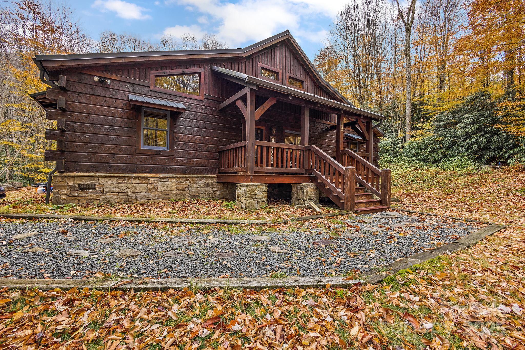 133 Buckeye Ridge Road Beech Mountain, NC 28604 - Photo 44 of 45 a front view of a house with garden