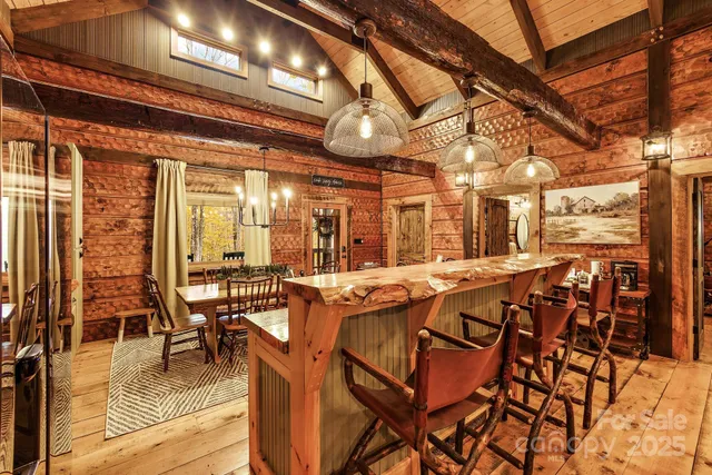 a view of a patio with dining table and chairs