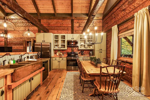 a dining room with furniture and a kitchen view