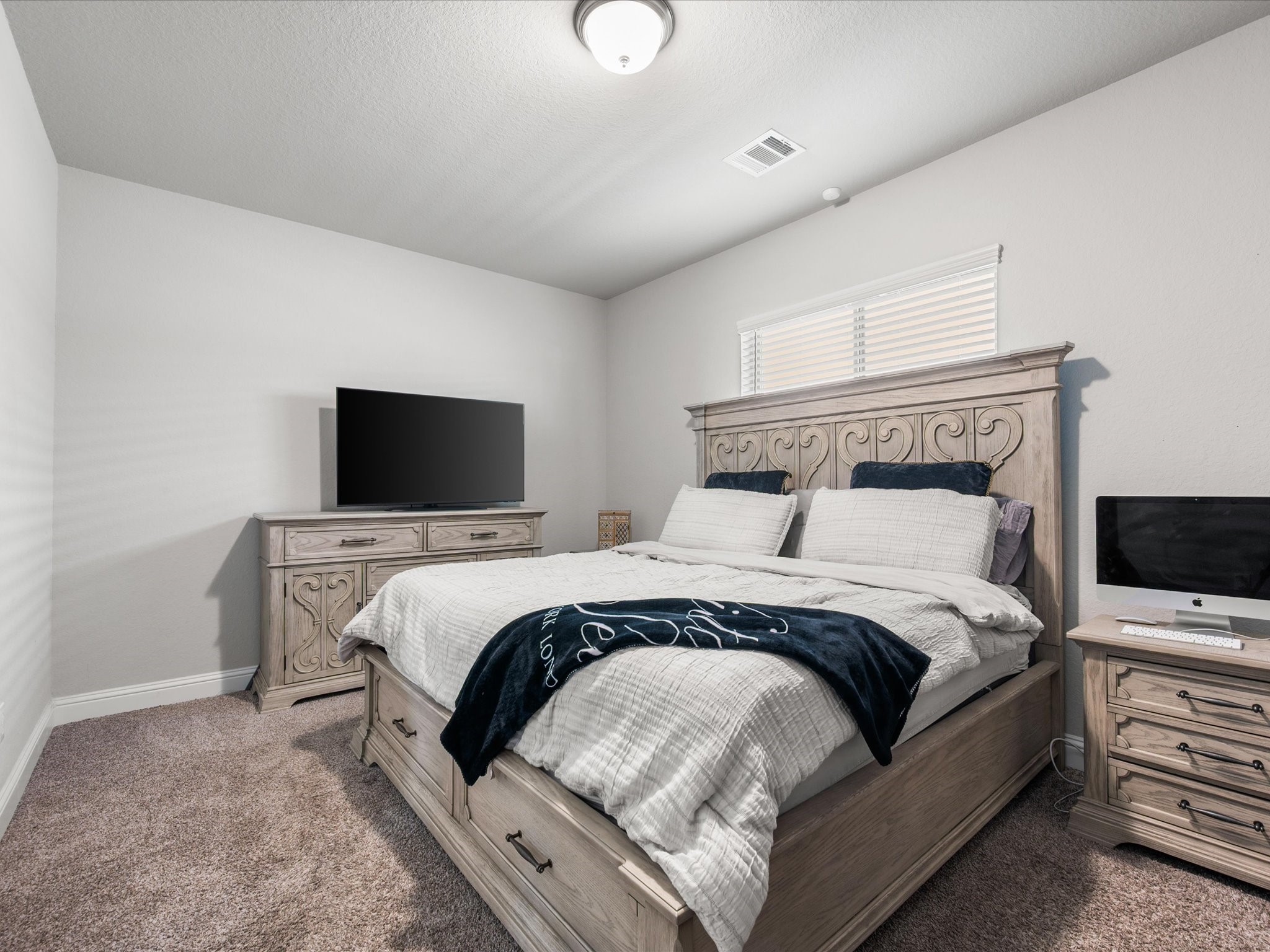 7123 Poppyseed Trail Spring, TX 77379 - Photo 17 of 30 A second downstairs bedroom offers exceptional flexibility—ideal for guests, multigenerational living, or a private home office.