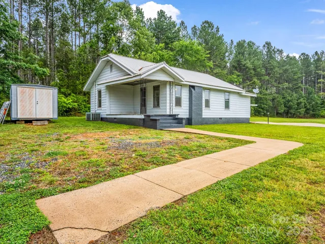 a view of a house with a swimming pool