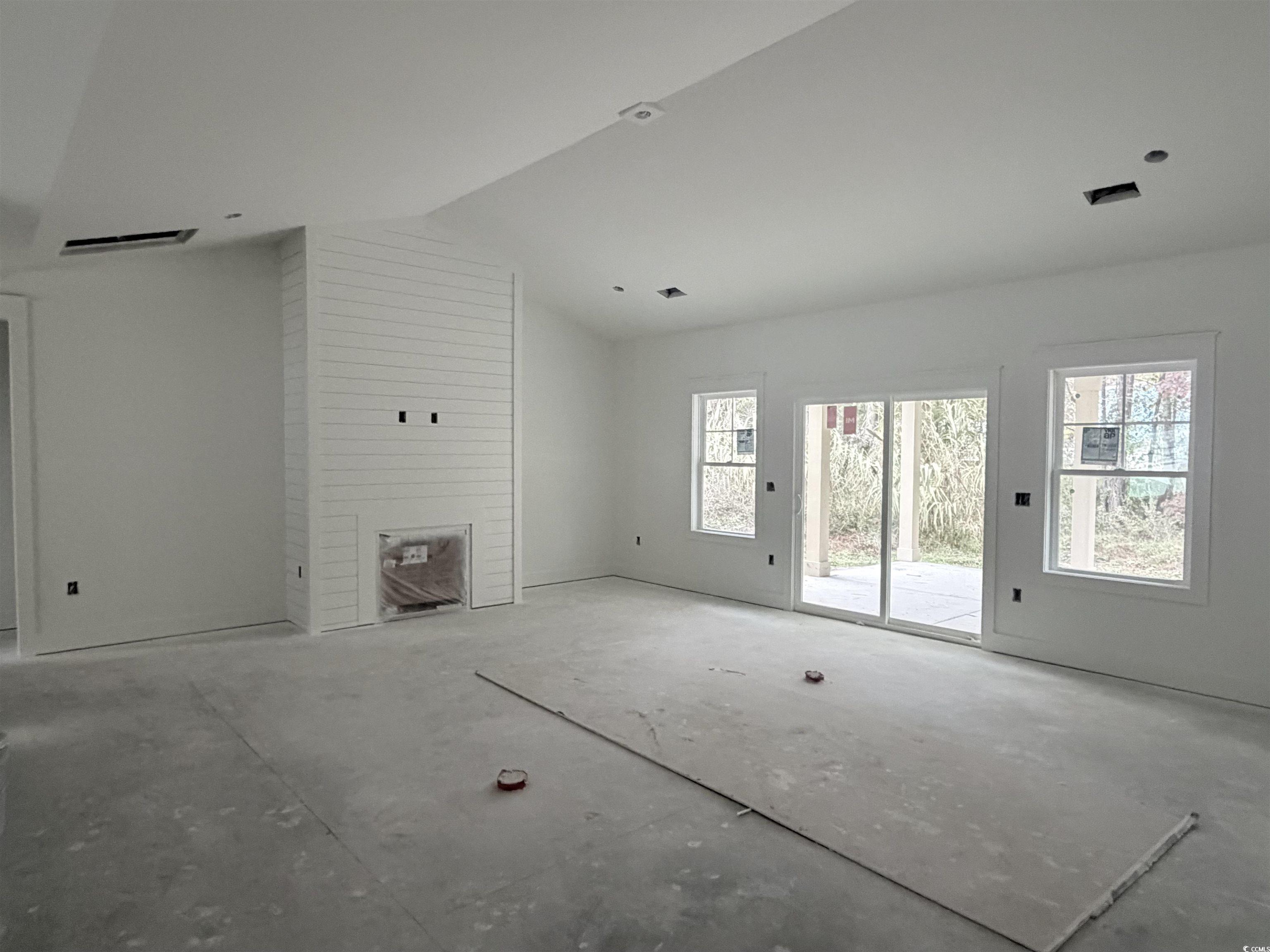 Ben Horry Trail Pawleys Island, SC 29585 - Photo 32 of 37 Unfurnished living room with lofted ceiling
