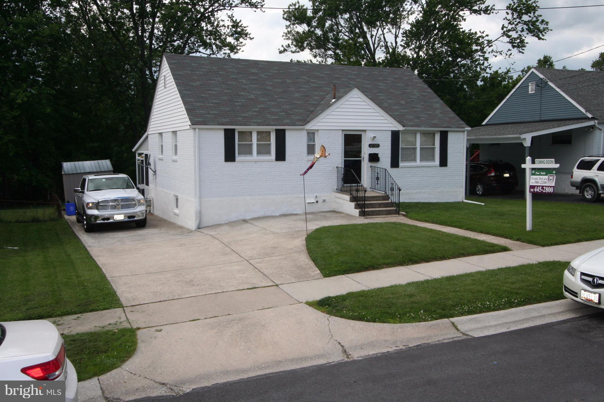 12720 Gould Road Silver Spring, MD 20906 - Photo 1 of 30 a aerial view of a house with a garden and pathway