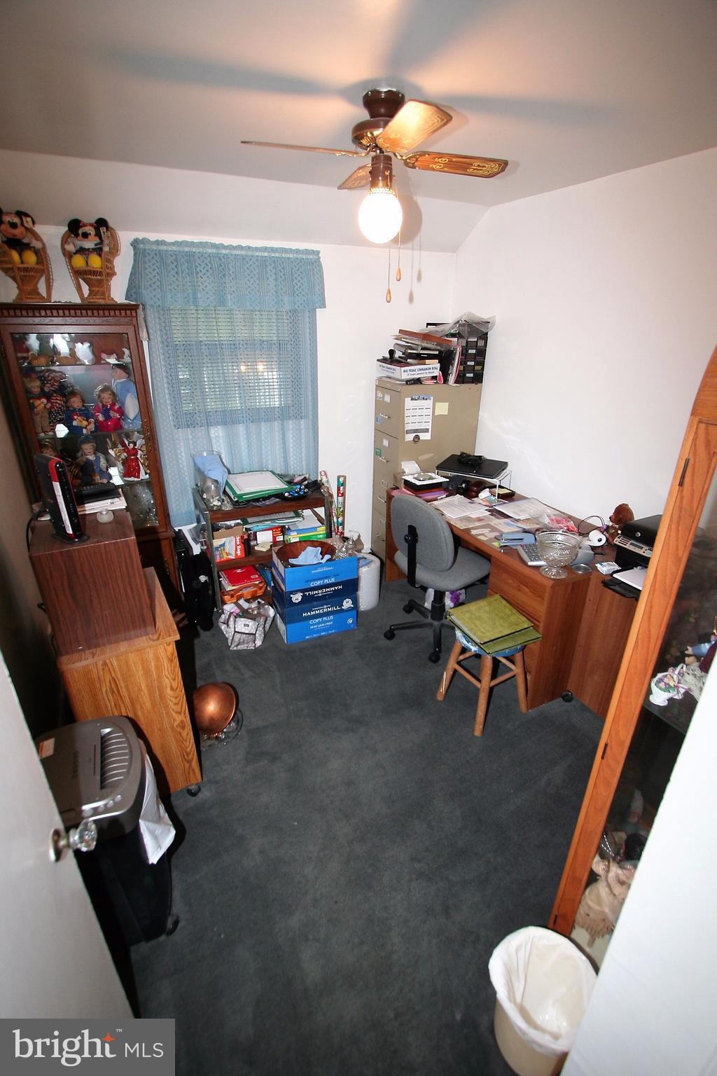 12720 Gould Road Silver Spring, MD 20906 - Photo 12 of 30 a room with furniture and a fan