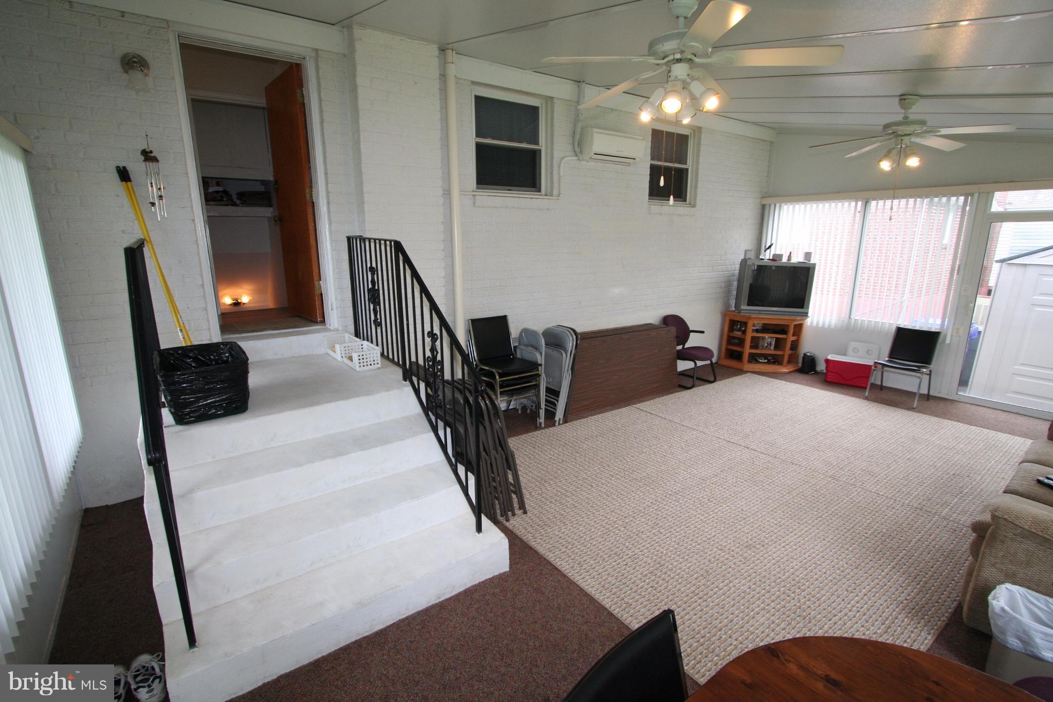 12720 Gould Road Silver Spring, MD 20906 - Photo 16 of 30 a living room with furniture and a flat screen tv